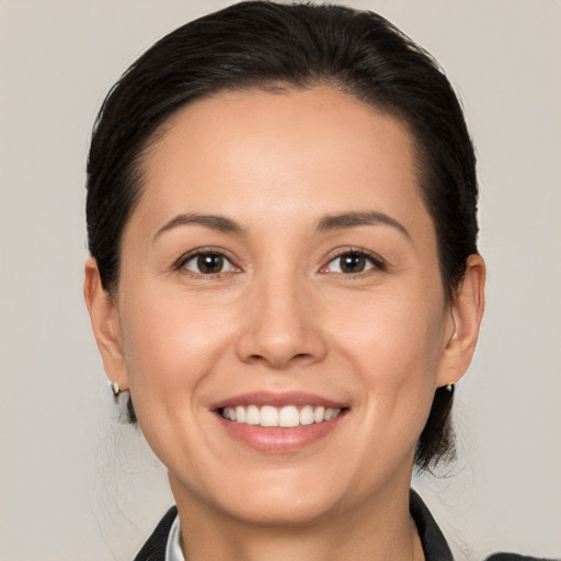 Joyful white young-adult female with medium  brown hair and brown eyes