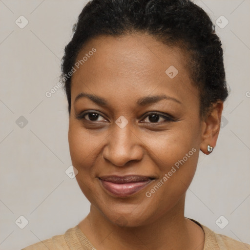 Joyful black young-adult female with short  brown hair and brown eyes