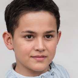 Joyful white child male with short  brown hair and brown eyes