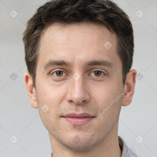 Joyful white young-adult male with short  brown hair and brown eyes