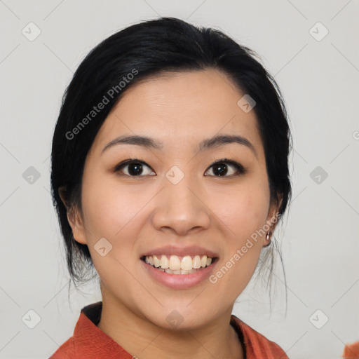 Joyful asian young-adult female with medium  black hair and brown eyes