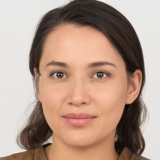 Joyful white young-adult female with medium  brown hair and brown eyes