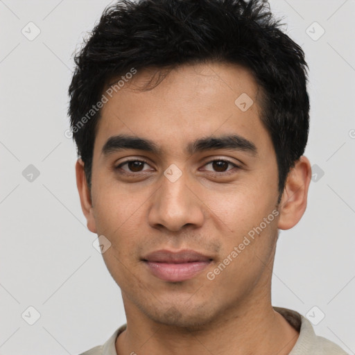 Joyful latino young-adult male with short  black hair and brown eyes