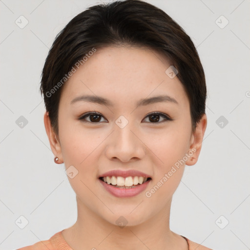 Joyful asian young-adult female with short  brown hair and brown eyes