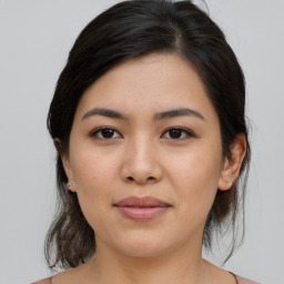 Joyful asian young-adult female with medium  brown hair and brown eyes