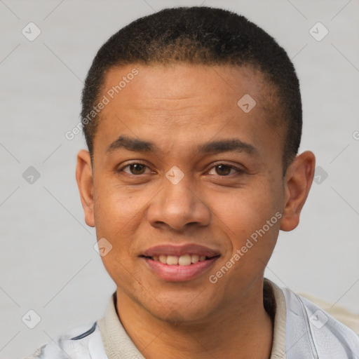 Joyful latino young-adult male with short  black hair and brown eyes