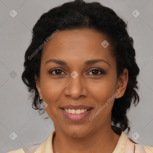 Joyful black adult female with medium  brown hair and brown eyes