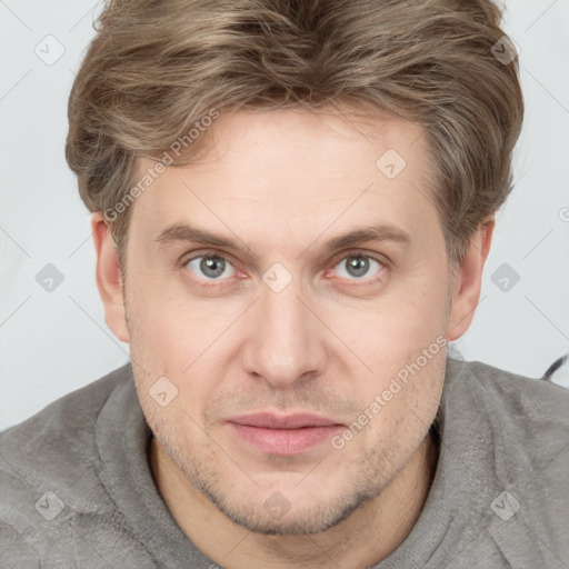 Joyful white adult male with short  brown hair and grey eyes