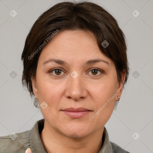 Joyful white adult female with short  brown hair and grey eyes