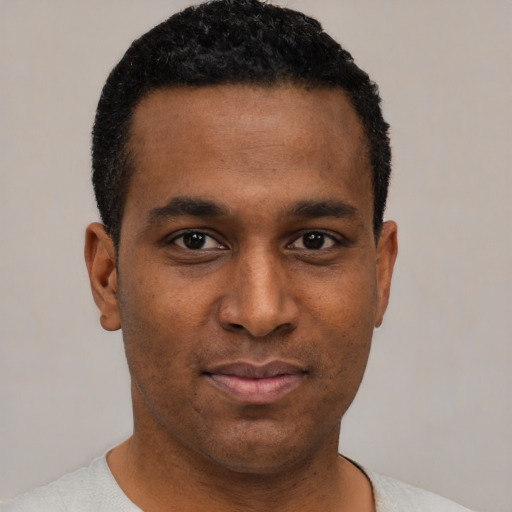 Neutral black young-adult male with short  black hair and brown eyes