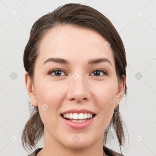 Joyful white young-adult female with medium  brown hair and grey eyes