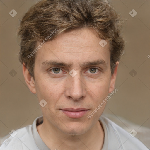 Joyful white adult male with short  brown hair and grey eyes