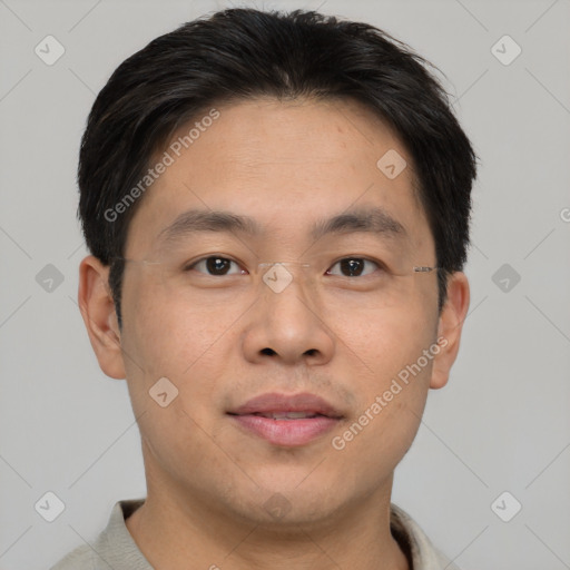 Joyful asian young-adult male with short  brown hair and brown eyes