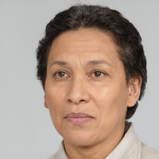 Joyful white middle-aged female with short  brown hair and brown eyes