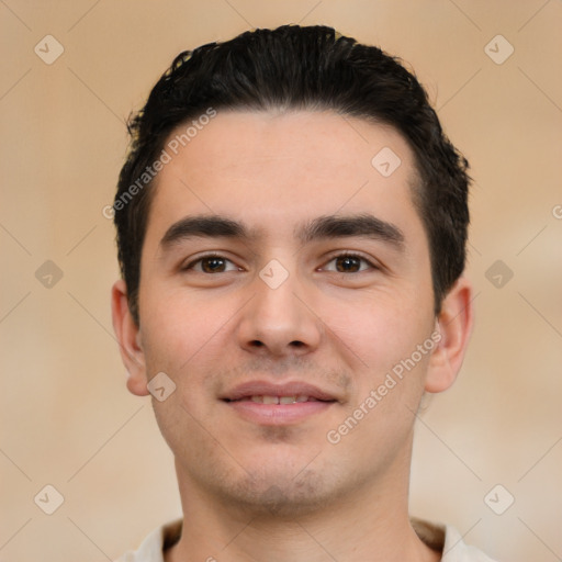 Joyful white young-adult male with short  black hair and brown eyes