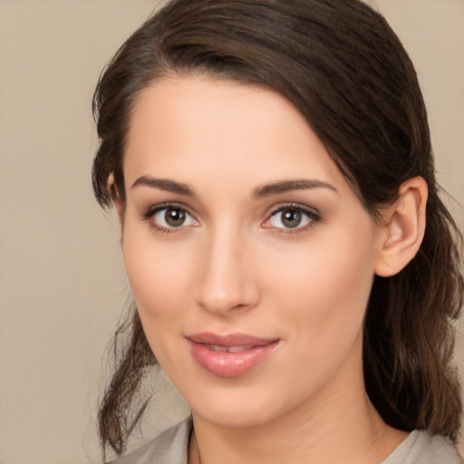 Joyful white young-adult female with medium  brown hair and brown eyes