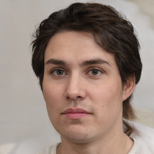 Neutral white young-adult male with medium  brown hair and brown eyes