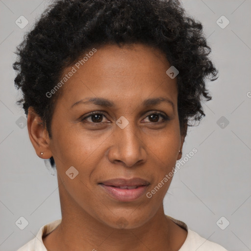 Joyful black adult female with short  brown hair and brown eyes