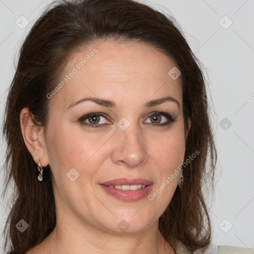 Joyful white adult female with long  brown hair and brown eyes