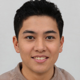 Joyful latino young-adult male with short  brown hair and brown eyes