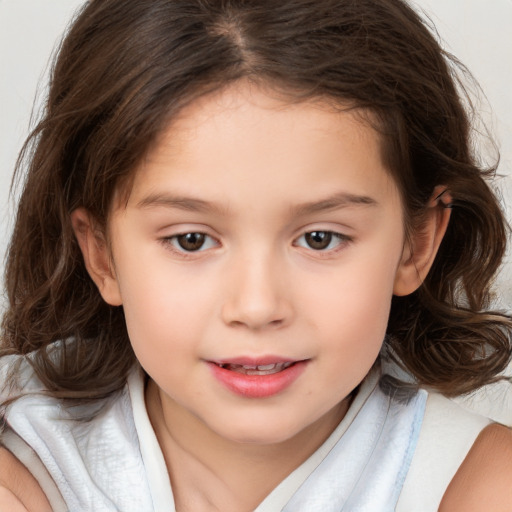 Joyful white child female with medium  brown hair and brown eyes