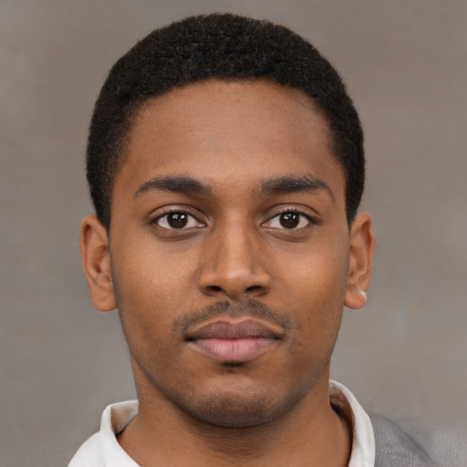 Neutral latino young-adult male with short  brown hair and brown eyes