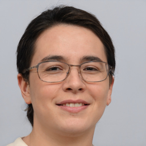 Joyful white young-adult male with medium  brown hair and brown eyes