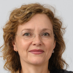 Joyful white adult female with long  brown hair and brown eyes