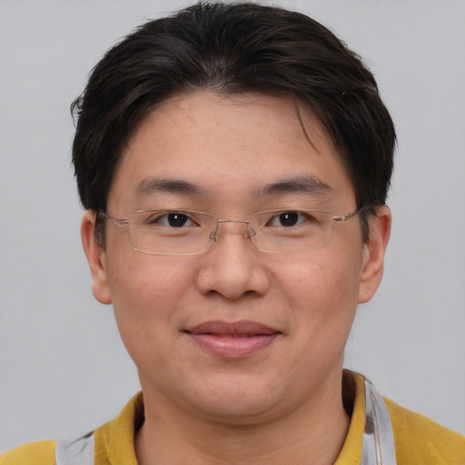 Joyful asian adult female with short  brown hair and brown eyes