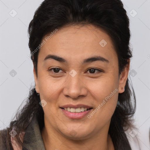 Joyful white adult female with medium  brown hair and brown eyes