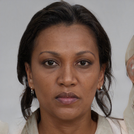 Neutral black adult female with medium  brown hair and brown eyes