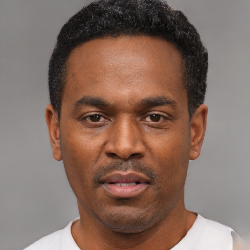 Neutral black adult male with short  black hair and brown eyes