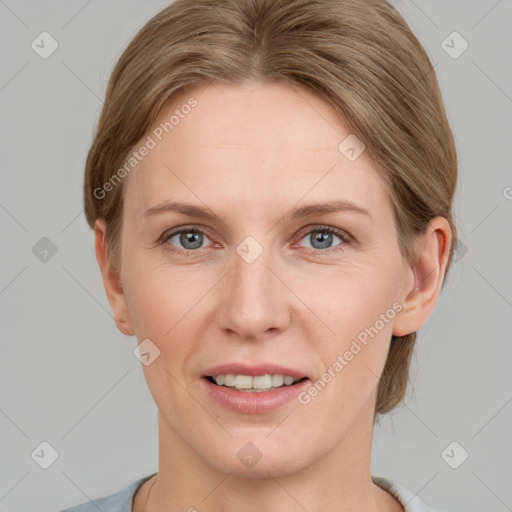 Joyful white adult female with short  brown hair and grey eyes