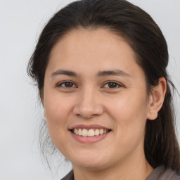 Joyful white young-adult female with medium  brown hair and brown eyes