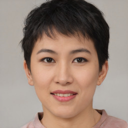 Joyful asian young-adult female with short  brown hair and brown eyes