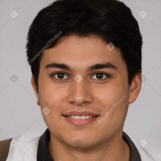 Joyful latino young-adult male with short  brown hair and brown eyes