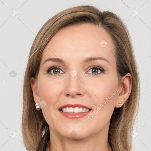 Joyful white young-adult female with long  brown hair and grey eyes