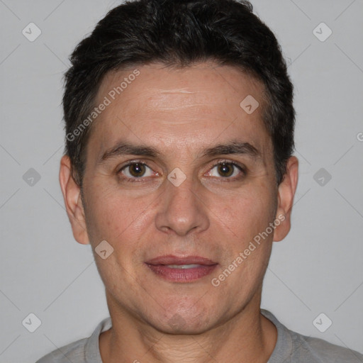 Joyful white adult male with short  brown hair and brown eyes