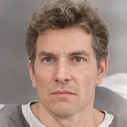 Neutral white adult male with short  brown hair and grey eyes