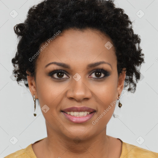 Joyful black young-adult female with short  brown hair and brown eyes