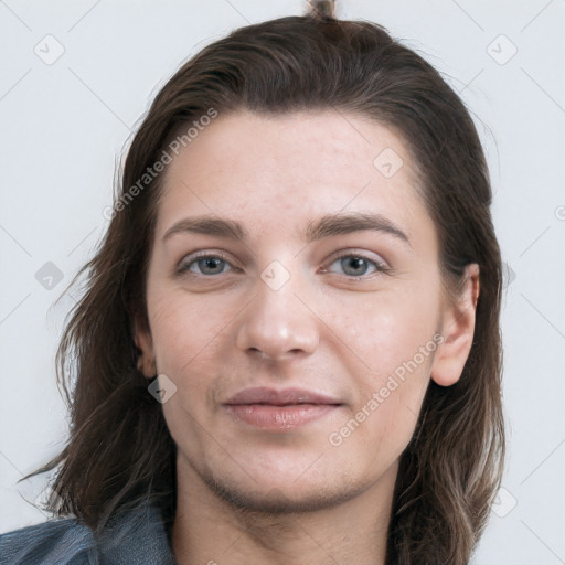 Joyful white young-adult female with long  brown hair and grey eyes