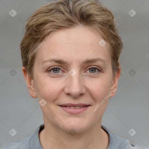 Joyful white adult female with short  brown hair and grey eyes