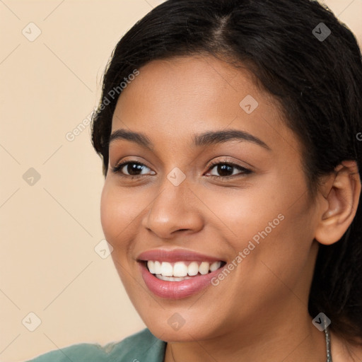 Joyful latino young-adult female with long  brown hair and brown eyes