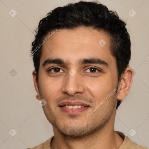 Joyful white young-adult male with short  black hair and brown eyes