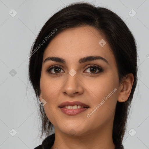 Joyful white young-adult female with long  brown hair and brown eyes