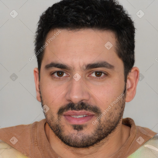 Joyful white young-adult male with short  black hair and brown eyes