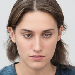 Neutral white young-adult female with medium  brown hair and grey eyes