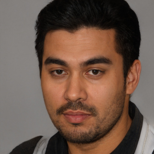 Neutral latino young-adult male with short  black hair and brown eyes