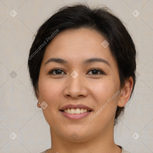 Joyful latino young-adult female with short  brown hair and brown eyes