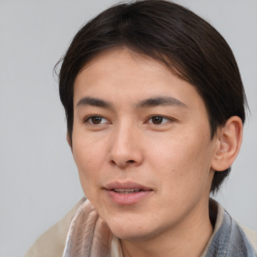 Joyful asian young-adult male with short  brown hair and brown eyes